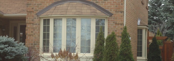 front of house with bow windows